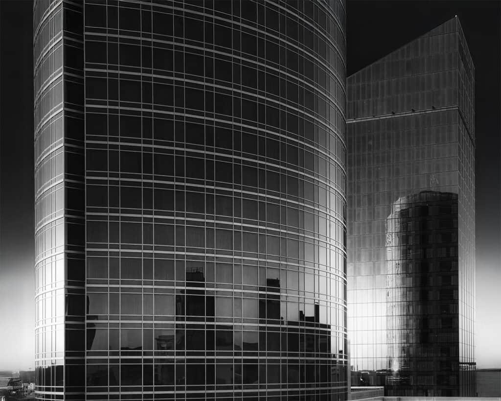 Reflective glass buildings showcasing urban architecture at Artprize event.